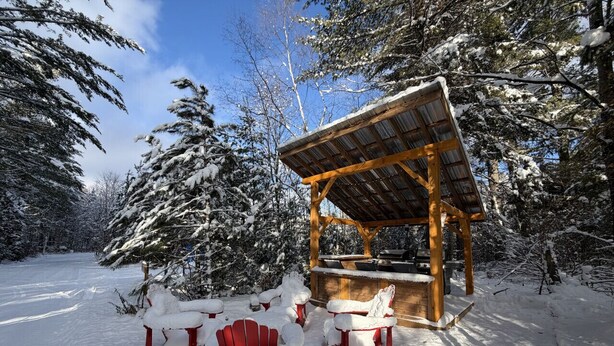A wooden gazebo with benches in a snowy forest. - Cozy Cabin on Oxtongue River; Wolf Cottage (Huntsville)