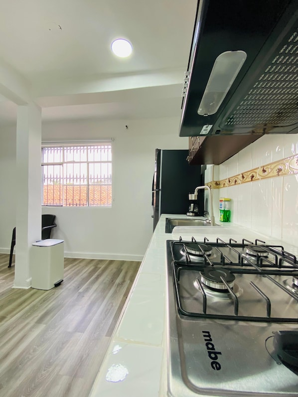 Fridge, microwave, stovetop, coffee/tea maker