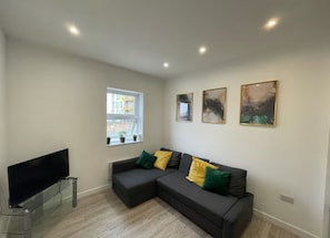 Apartamento, vista para a cidade | Área de estar