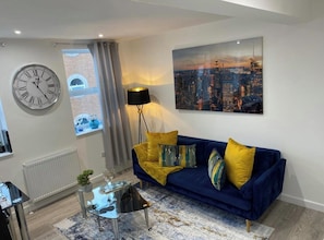 Apartamento, vista para a cidade | Área de estar