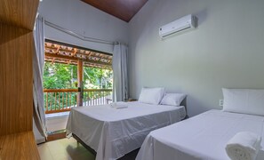 A hotel room with two beds, a ceiling fan, and a window with curtains. - Beautiful House With Pool, Arraial D'ajuda Lvl001 (Porto Seguro)
