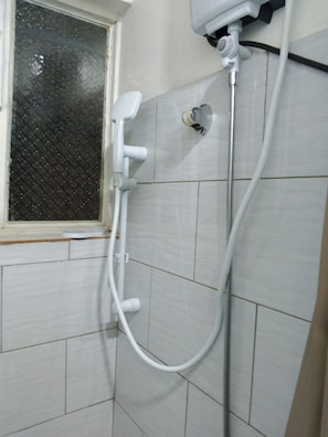 Shower, towels, toilet paper