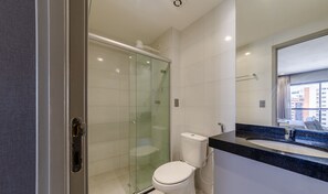 A modern bathroom with a glass-enclosed shower, a toilet, and a sink with a large mirror. - Studio w/ Pool 300m From the Beach- Maceio Eti0724 (Maceió)