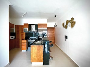 Deluxe Apartment, City View | Private kitchen | Full-size fridge, microwave, oven, stovetop