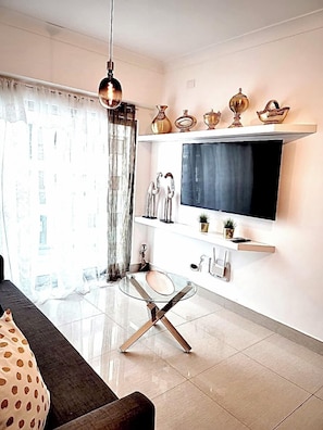 Appartement Deluxe, vue ville | Coin séjour