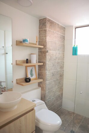Shower, hair dryer, towels, soap