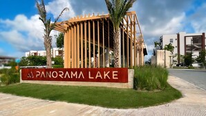 A modern building with a sign reading "PANORAMA LAKE."