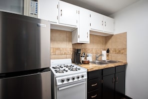 Suite, Multiple Beds, Kitchen | Private kitchen