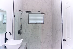Shower, hair dryer, towels, soap