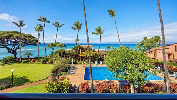 A resort with a swimming pool, palm trees, and a view of the ocean. - Kuleana Club - 319 (Lahaina)