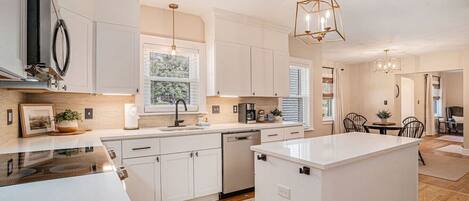 Coffee/tea maker, fridge, microwave, oven