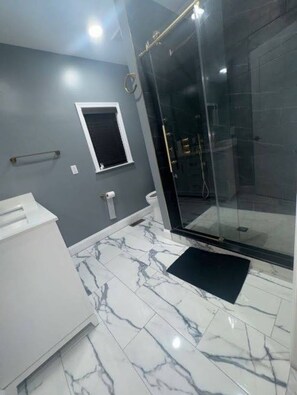 Shower, hair dryer, towels, soap