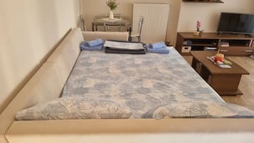 1 bedroom, desk, iron/ironing board, travel crib