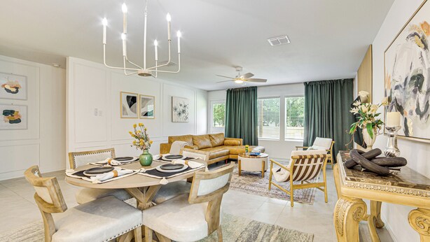 A dining area with a round table, chairs, and a chandelier. There is a sofa and a coffee table in the background. - ~ 10 Mi to Dallas Hospitals: Stylish Home w/ Yard! (Dallas)