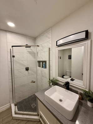 Shower, towels, soap, toilet paper