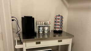 A white utility cart with a microwave, a coffee maker, and a mug. - Cozy Studio Min to JPS, Medical City, Historic District, Zoo, Water Gardens (Fort Worth)