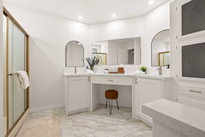 Shower, hair dryer, towels, shampoo
