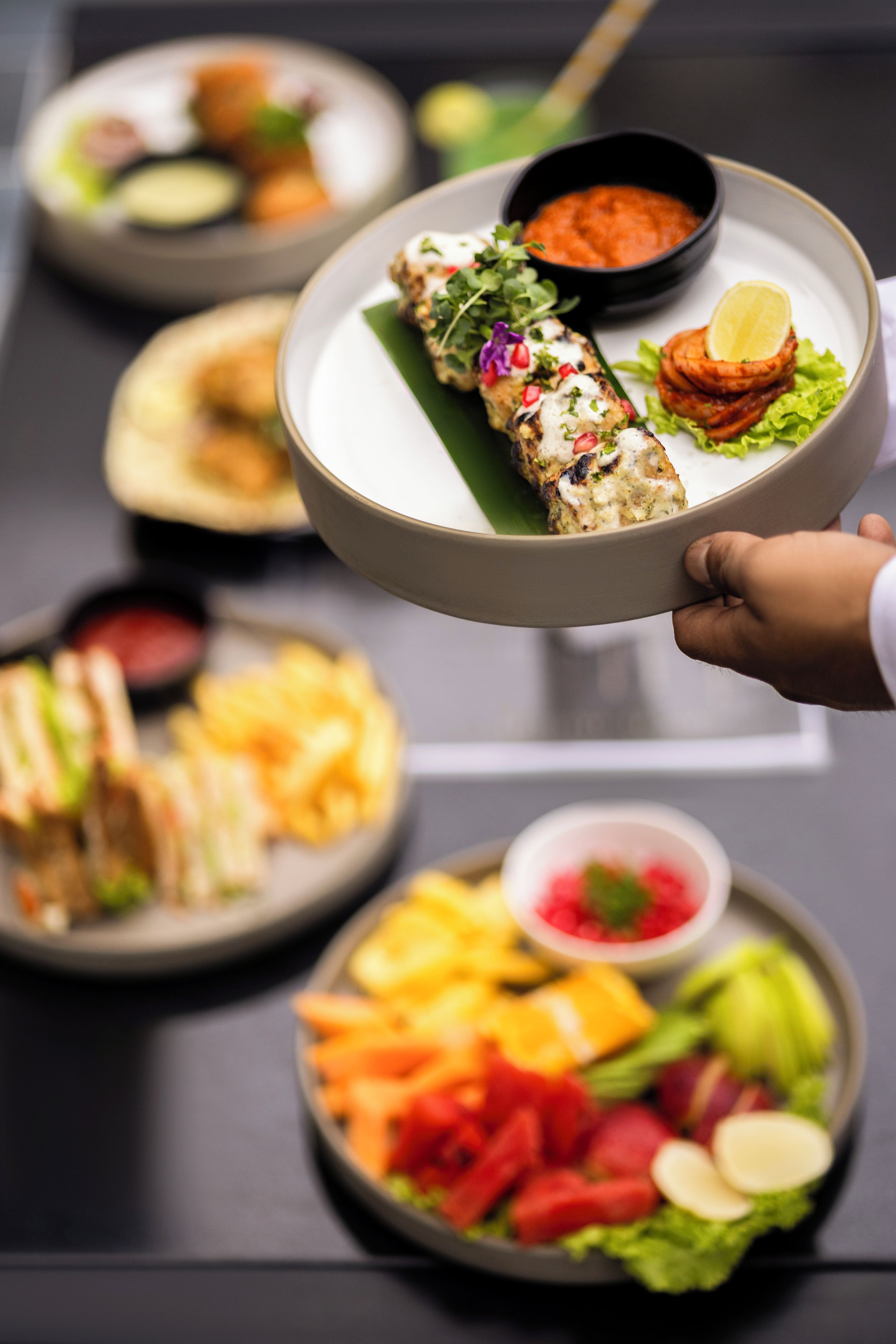 A variety of dishes including a rolled meat dish, a salad, and a bowl of soup.