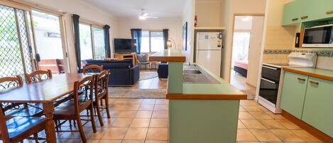 Fridge, microwave, dining tables