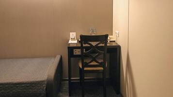 Basic Twin Room | In-room safe, desk, laptop workspace, blackout drapes