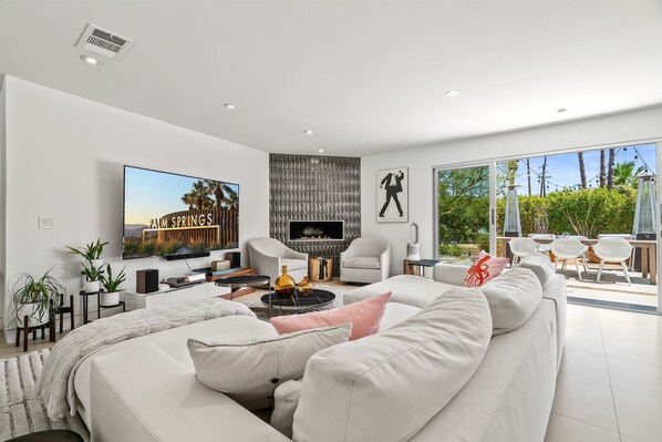 Smart TV, fireplace, books, printers