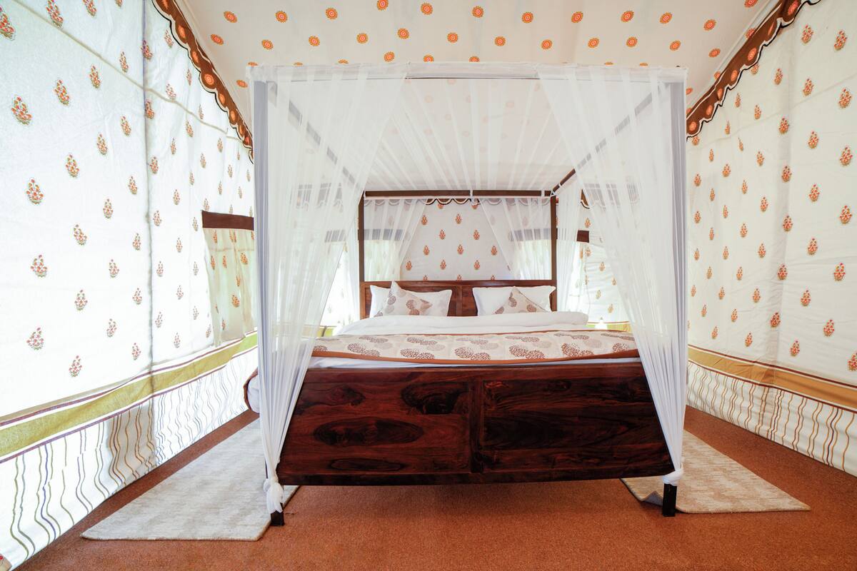 Premium tent | Desk, laptop workspace, blackout drapes, iron/ironing board