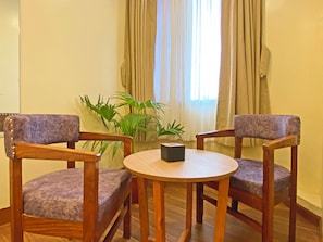 Deluxe Quadruple Room, City View | Desk, laptop workspace, free WiFi