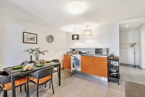 Family Apartment, 1 Bedroom, Mountainside (Oasi Panoramica con piscina) | Private kitchen | Fridge, microwave, stovetop, coffee/tea maker