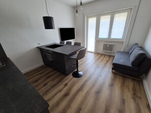 Apartamento Deluxe, balcón | Zona de estar