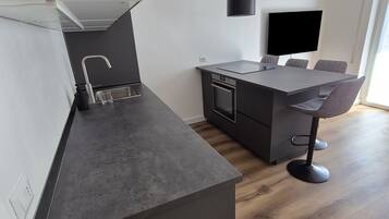 Deluxe Apartment, Balcony | Private kitchen | Full-sized fridge, stovetop, cookware/dishes/utensils