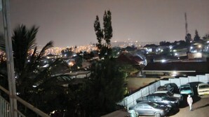 A nighttime view of a cityscape with a parking area in the foreground. - Marvelous studio in Kigali
Note this is just a room ensuit without kitchen (Kigali)