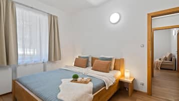 Departamento familiar, 1 cama Queen size y sofá cama | Cunas gratuitas, wifi gratis y ropa de cama