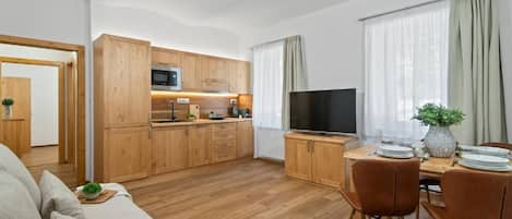 Family Apartment, 1 Queen Bed with Sofa bed | Living room | 50-inch flat-screen TV with digital channels