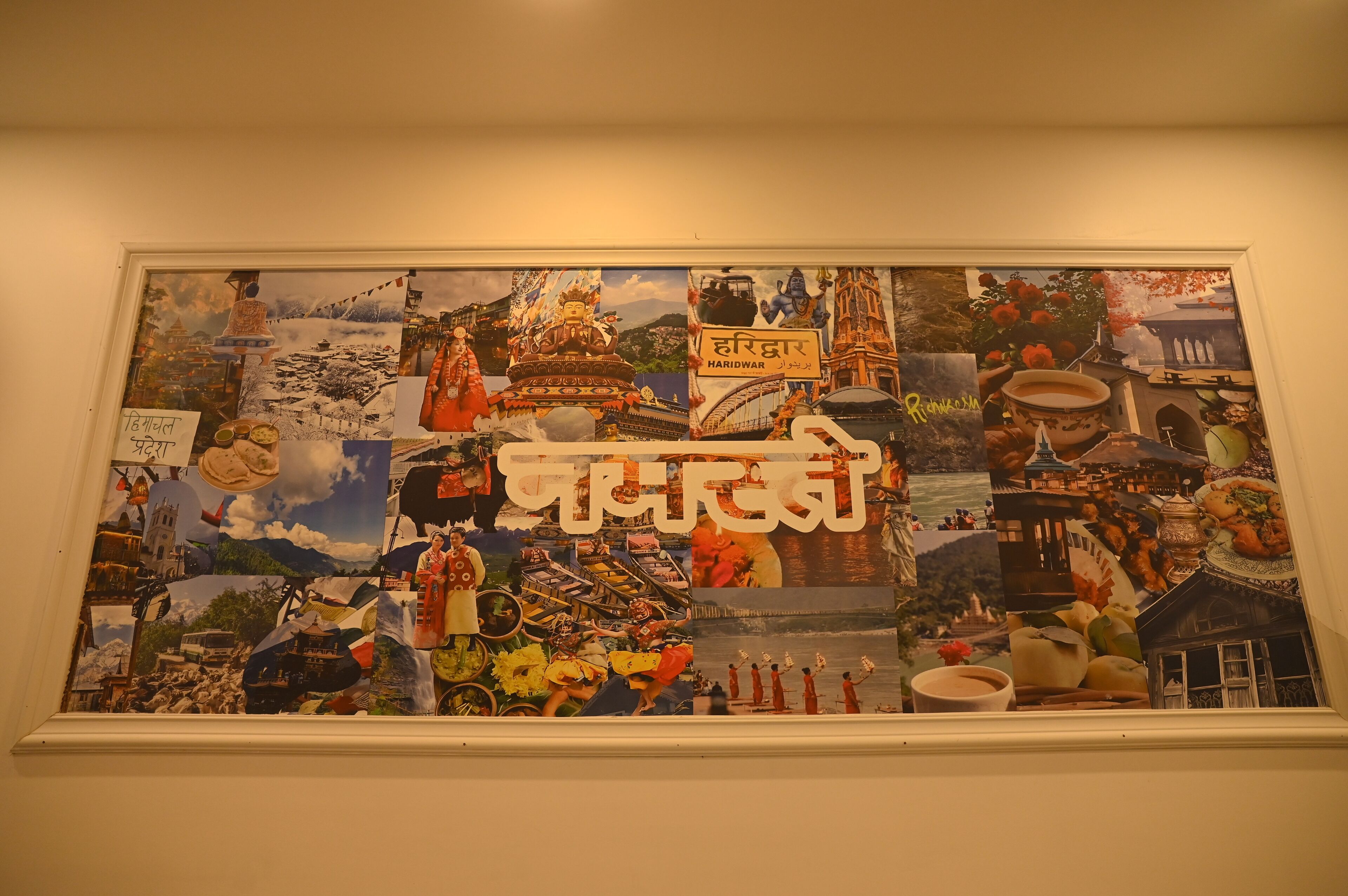 A collage of various cultural and scenic images on a wall.