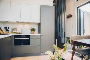 Microwave, dishwasher, dining tables