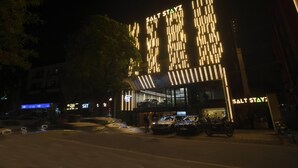A building with illuminated signage reading "SALT STAYZ" at night. - Saltstayz Premier Naraina Central Delhi (New Delhi)