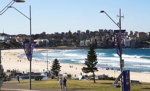 A beach with a view of a city in the background.