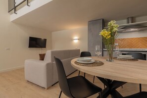 Classic Loft | Living area | 30-inch TV with satellite channels