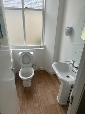 Separate tub and shower, towels, soap, shampoo