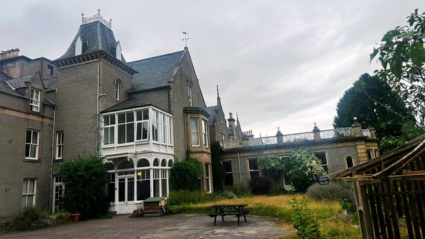 A historic building with a prominent bay window, a covered porch, and a gravel courtyard. - Cluny Hill Hotel (Forres)