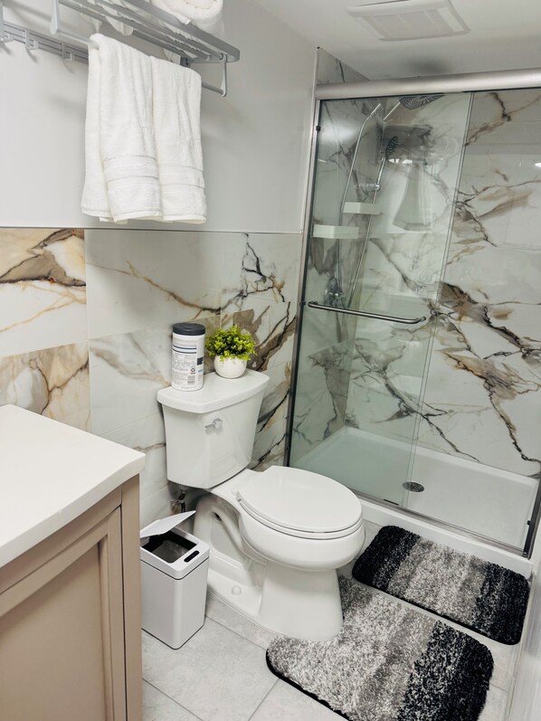Hair dryer, towels, soap, toilet paper