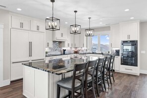 Fridge, microwave, oven, stovetop - Experience luxury at Sounds Salty, a stunning 7-bedroom oceanview home in Oak Island. (Oak Island)