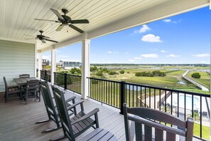 Outdoor dining - Experience luxury at Sounds Salty, a stunning 7-bedroom oceanview home in Oak Island. (Oak Island)