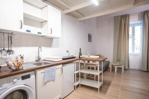 Fridge, microwave, stovetop, coffee/tea maker