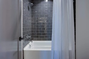 Shower, hair dryer, towels, shampoo