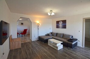 Apartment, Balcony, Sea View | Living area | 80-cm flat-screen TV with satellite channels