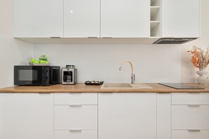 Fridge, microwave, stovetop, coffee/tea maker