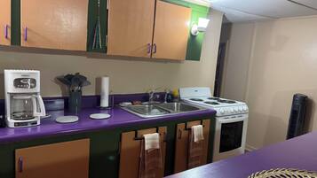 Fridge, microwave, stovetop, coffee/tea maker