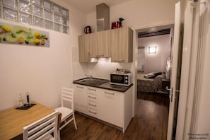 Fridge, microwave, stovetop, coffee/tea maker