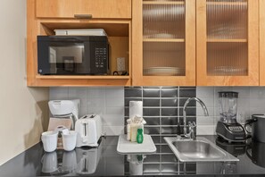 Microwave, coffee/tea maker, toaster, cookware/dishes/utensils